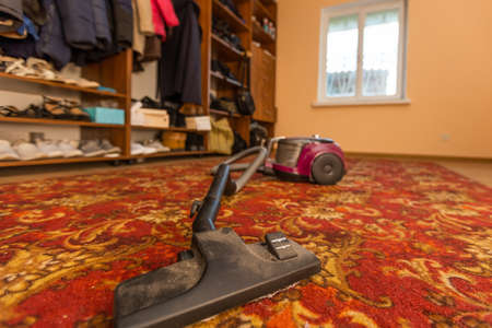 dirty vacuum cleaner in the dressing roomの写真素材