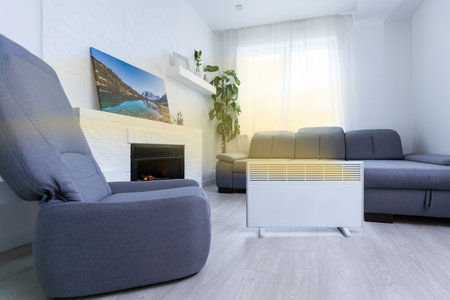 Modern electric infrared heater in living roomの写真素材