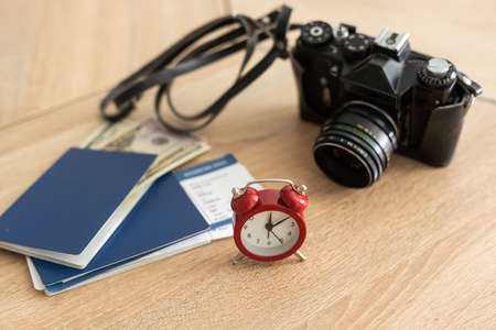 Passport, tickets and camera. alarm clockの写真素材