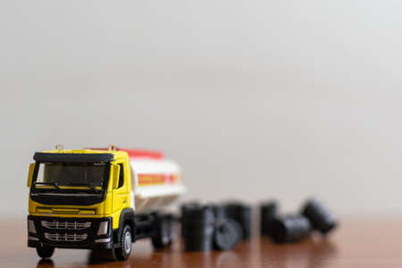 small toy combine with toy oil barrelの写真素材