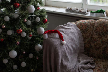Christmas, New Year interior, decorated fir tree with garlands and ballsの写真素材