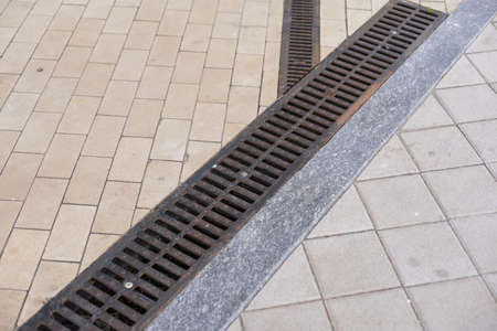 Pavement rocks, stones and cobblestone blocks, construction of path, road or sidewalkの写真素材