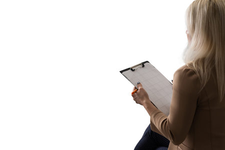 therapist taking notes on white background