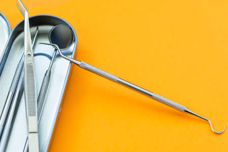 Pile of dentist tools lying ready to be used close-upの写真素材
