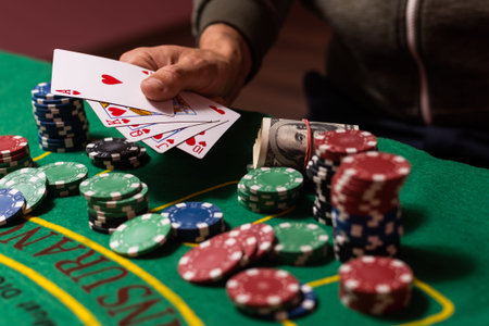 man playing blackjack at the table and betting chips