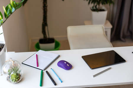 tablet putting on wooden working desk with pencil and penの写真素材