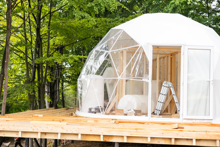 building a dome tent in the mountainsの写真素材