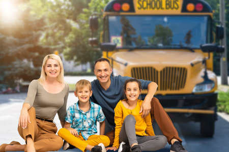 family together by the school bus