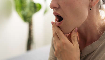 Toothache, Beautiful Woman with Tooth Infection. Young Woman Suffering From Toothache . Close up of pretty disappointed woman which having toothache.の写真素材