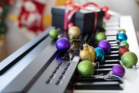 Piano keyboard with Christmas decoration, closeupの写真素材
