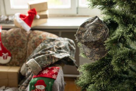 Christmas in the army. ball and gift box, military uniform, closeup viewの写真素材