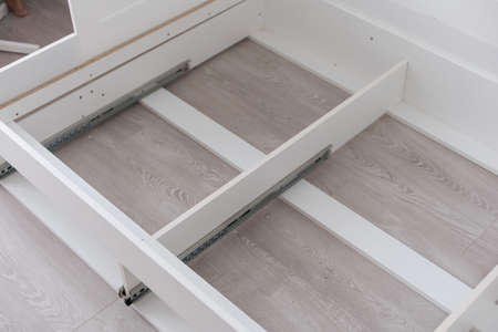 Disassembled sleeping bed. Renovation work in the room.の写真素材