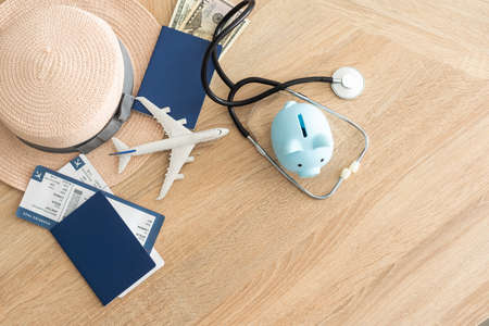 Medical Tourism, medical travel concept. Stethoscope, toy plane and passport on wooden backgroundの写真素材