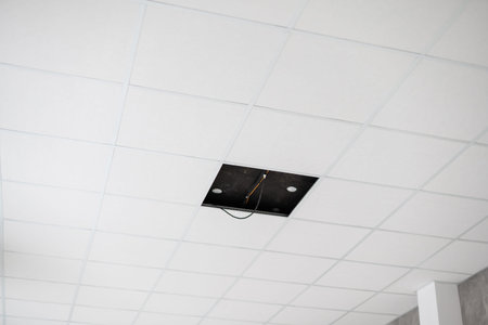 White ceiling in the office. White ceiling can reflect light well. The right light at work. Abstract...