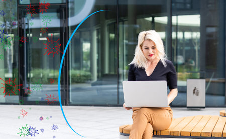 Stronger immunity - better disease resistance. Young woman surrounded by viruses on light backgroundの写真素材