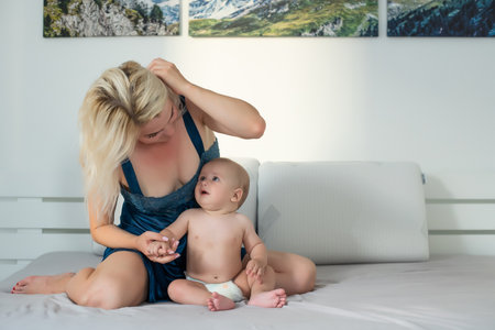 picture of happy mother with baby over whiteの写真素材