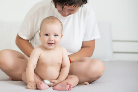 picture of happy mother with baby in hands