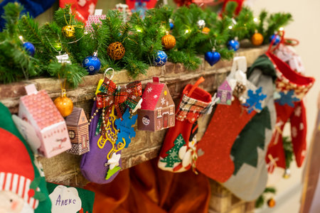 Christmas decoration stocking and toys hanging over rustic wooden backgroundの写真素材