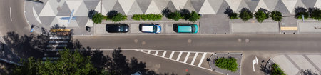 aerial top view of street with parking lot near new residential housing complex