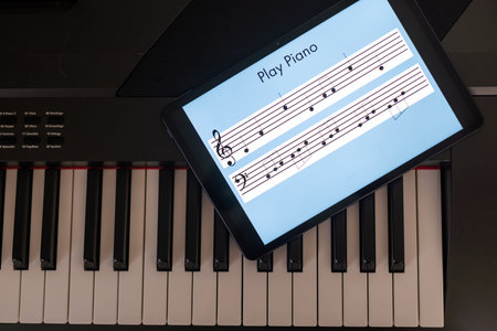 Piano synthesizer app on tablet and musical instrument conceptの写真素材