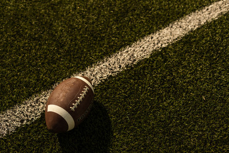 American football on football field backgroundの写真素材