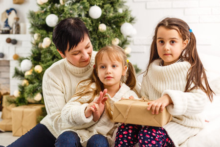 mother and children at home for christmas