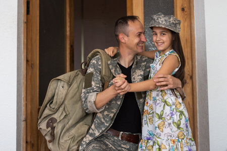 Affectionate military father with daughter at home.の写真素材