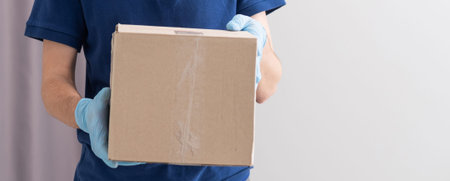 handsome young delivery man portrait on white