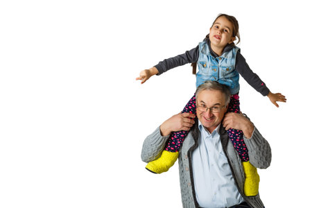 Authentic photo of smiling grandfather hugging with his granddaughter