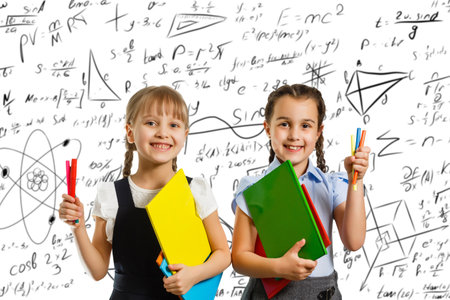 children on the background of formulas, isolated on wall chalk board background. Childhood children kids education lifestyle conceptの写真素材