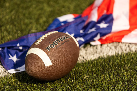 american football ball and flag