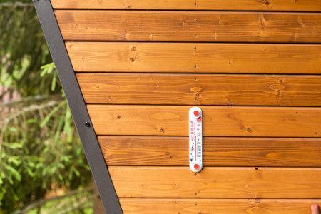 A THERMOMETER measures the air temperature.