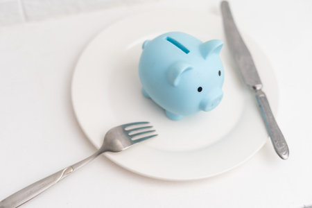 Piggy Bank on plate on White Background.の写真素材