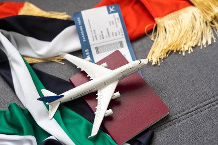 UAE flag with passport, ticket and toy planeの写真素材