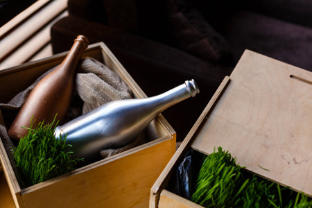 Wooden box with empty wine bottles, bottles blurred.の写真素材