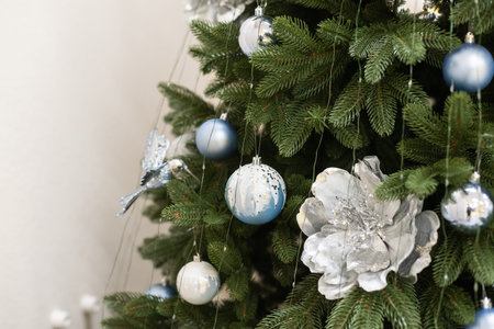 Christmas background - baubles and branch of spruce tree.