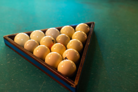 White billiard balls for billiards, a triangle on the table. White billiard balls for billiards on a blue background.の写真素材