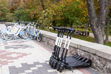 Kyiv, Ukraine - October 1, 2022: Electric urban transportation: the row of electric readies to ride...