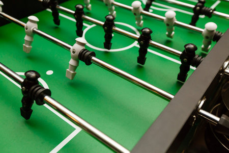 Table football in the entertainment center. Close-up image of plastic players in a football gameの写真素材