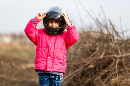 Child with motorbike helmet, safety conceptの写真素材