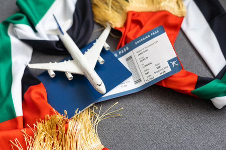 UAE flag with passport, ticket and toy planeの写真素材