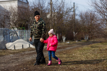 Granddaughter with cute little granddaughter enjoyingの写真素材