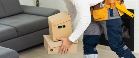 Young man working at a warehouse with boxes
