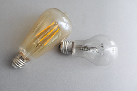 Alternative technology concept . Bulb and Fluorescent bulb comparing