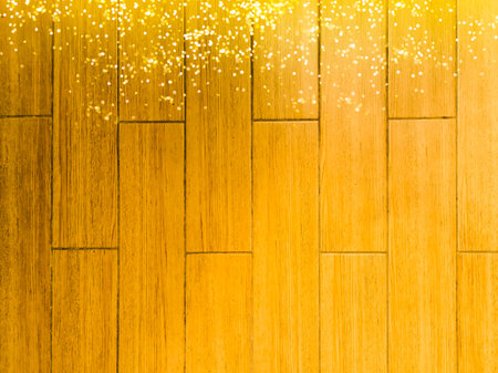 Glowing Christmas tree garland on a wooden backgroundの写真素材