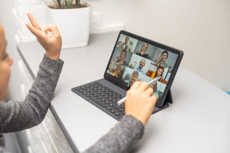 Happy teenager girl on line with a laptop in the living room at home