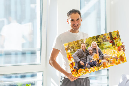 Canvas print with gallery wrap. man hangs autumn photography, photocanvasの写真素材