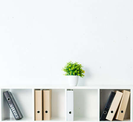 White office shelves with different stationery, close up.の写真素材