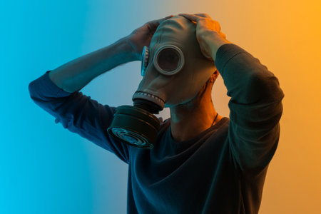 Close-up portrait of his he nice professional disinfectant wearing gas mask showing copy empty blank place space quarantine rules restrictions isolated over color backgroundの写真素材
