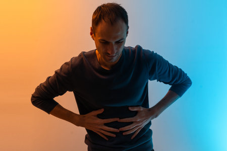 man has a stomach ache color background